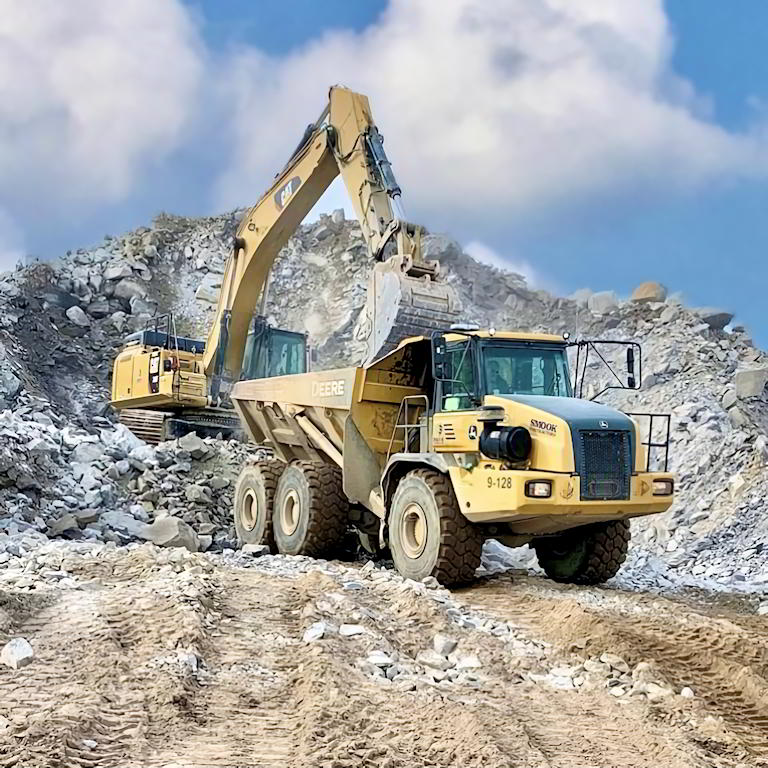 Excavator loading dump truck