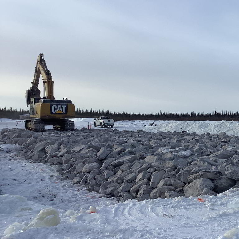 Excavator on winter construction site