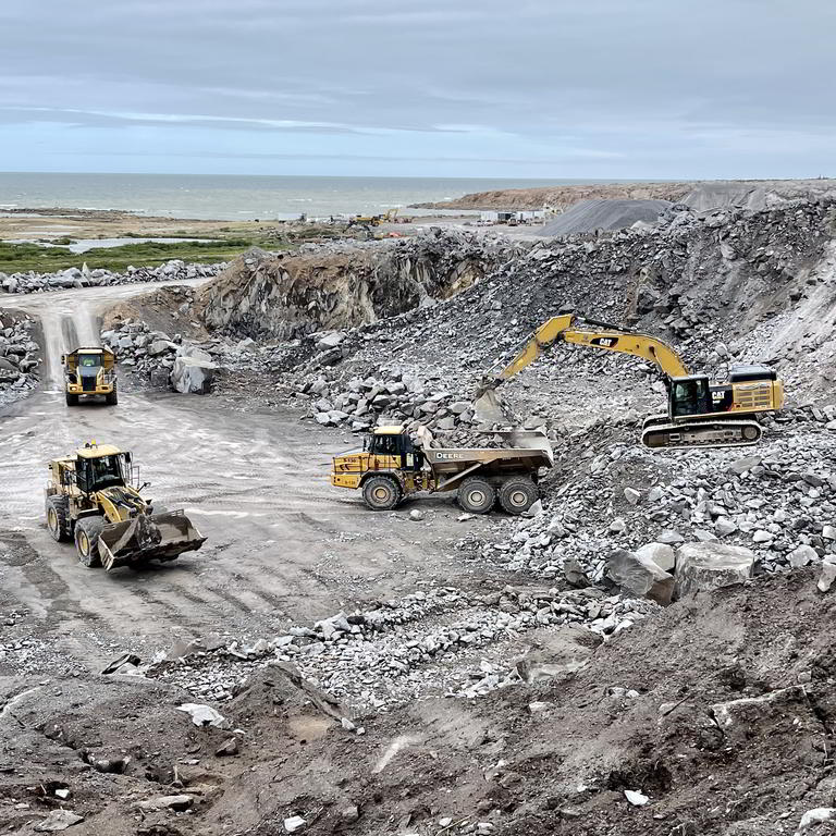 Quarry operations with excavator and haulers
